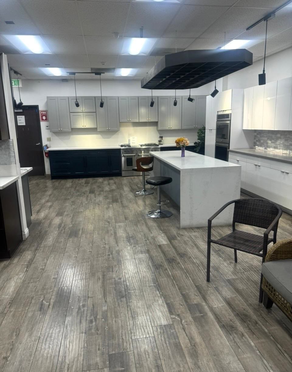 Completed white and navy kitchen with island and hardwood floors