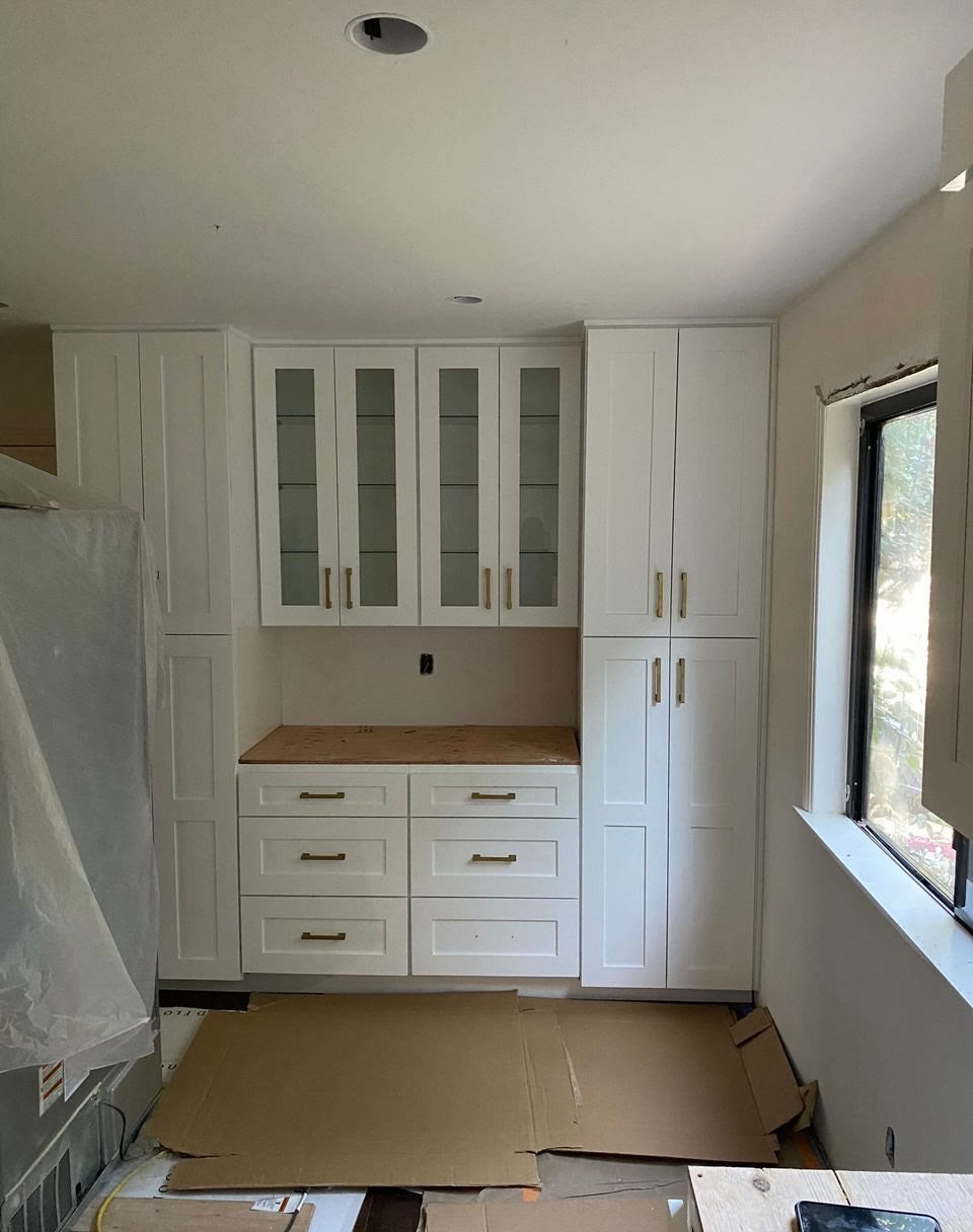 Tall white pantry cabinet installation