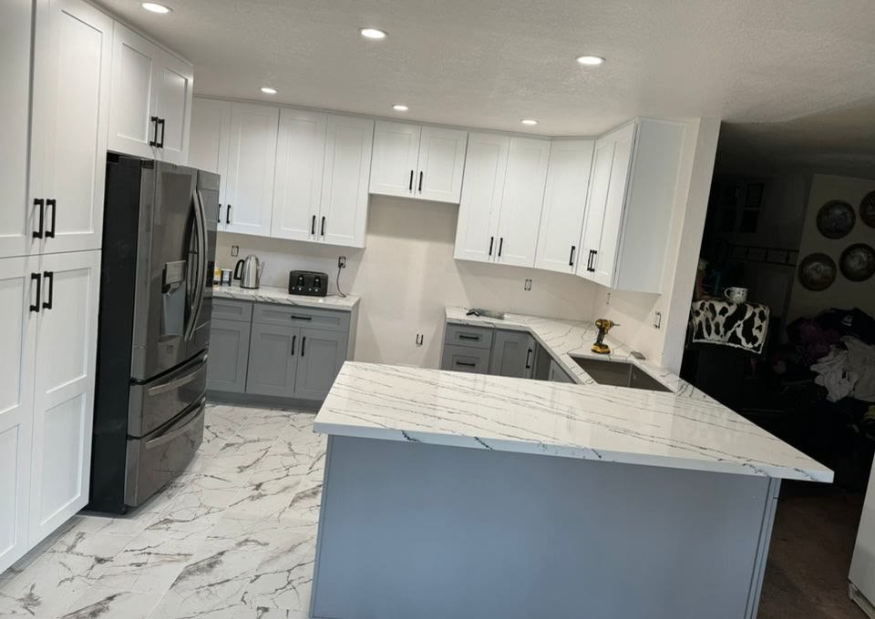 Completed white kitchen with marble floors
