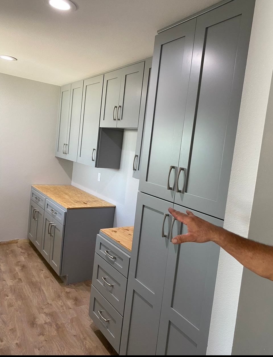 Gray cabinets during countertop installation