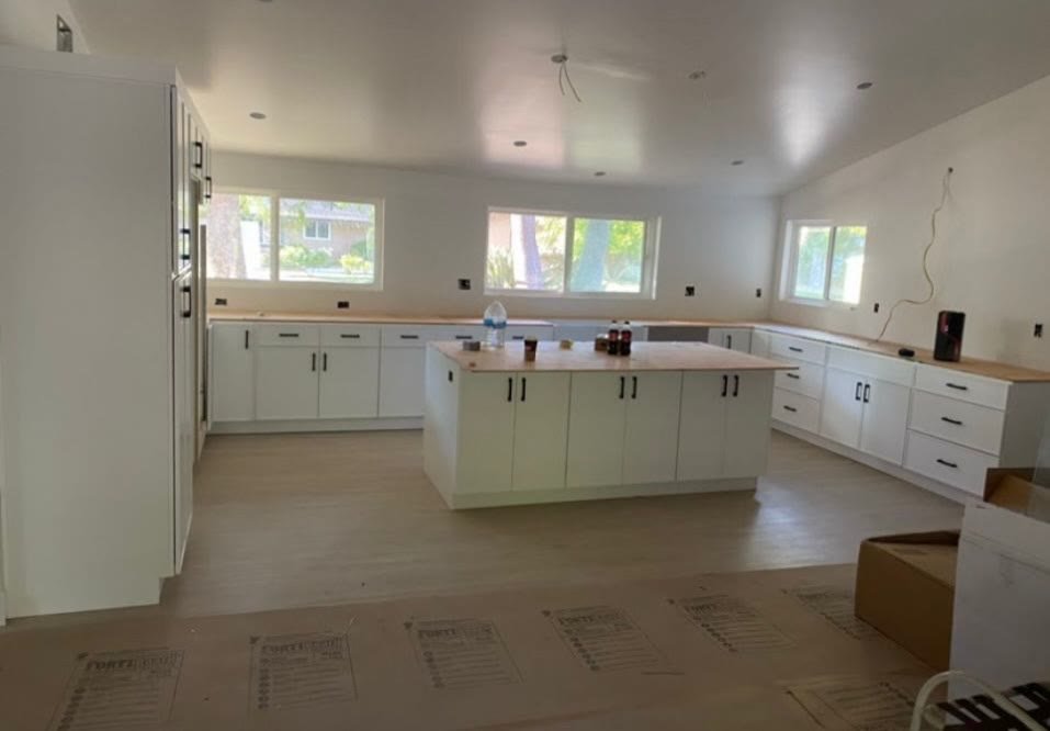 Large gray kitchen nearing completion